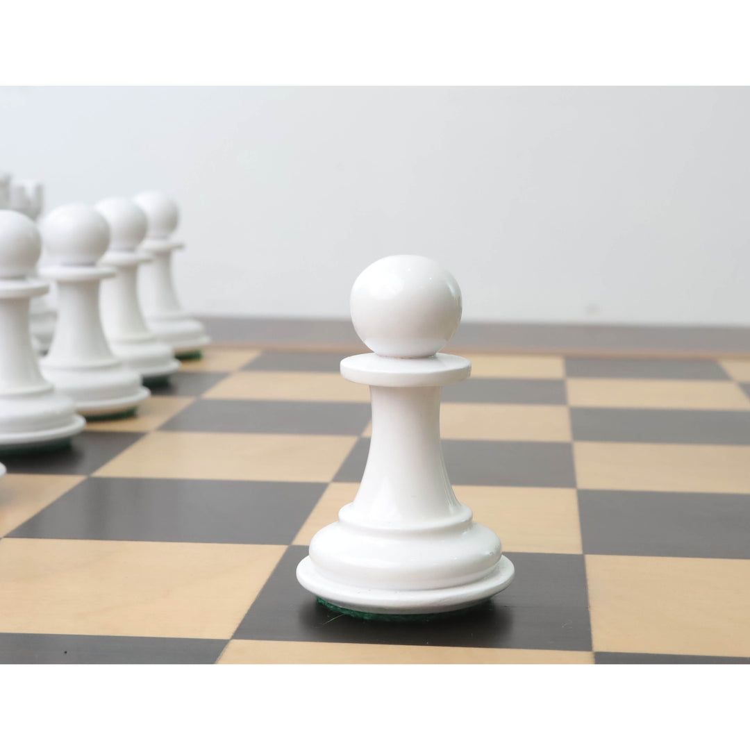 White lacquer boxwood pawn from the 1940s Soviet reproduction chess set on a checkered board.