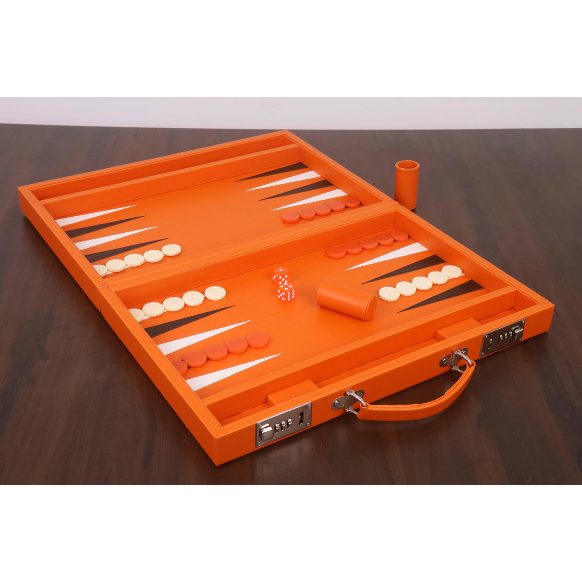 Portable orange backgammon board set up with orange and cream checkers, dice, and doubling cube.