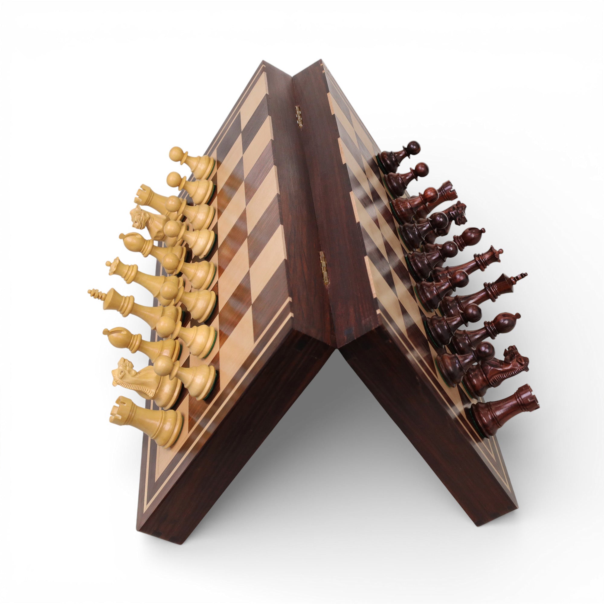 Strong magnetic chess pieces staying firmly in place on a tilted rosewood and maple board.