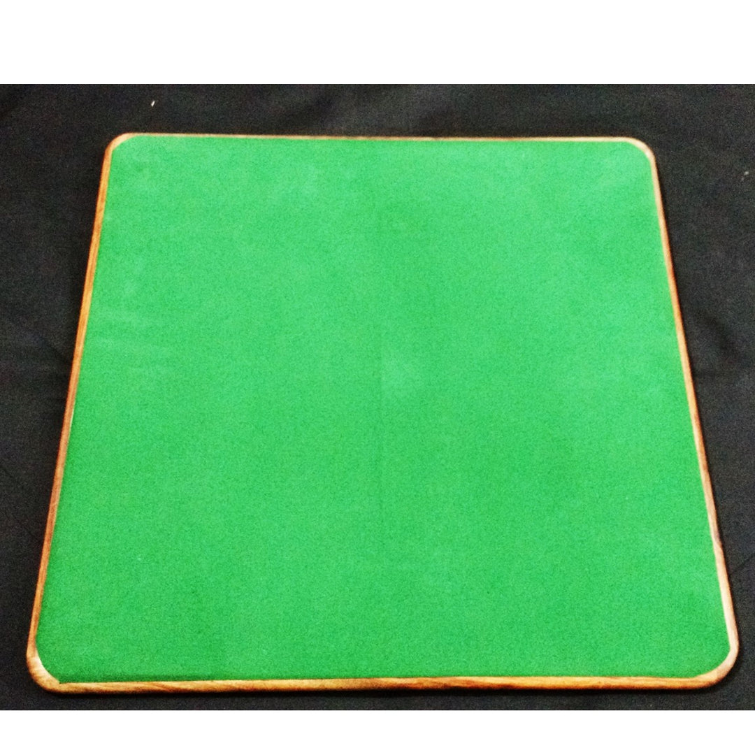 Underside of a 17 inch wooden chess board featuring a protective green felt base to prevent scratches.