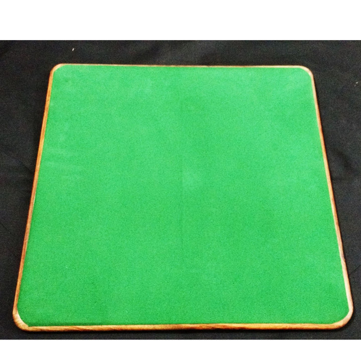 Underside of a 17 inch wooden chess board featuring a protective green felt base to prevent scratches.