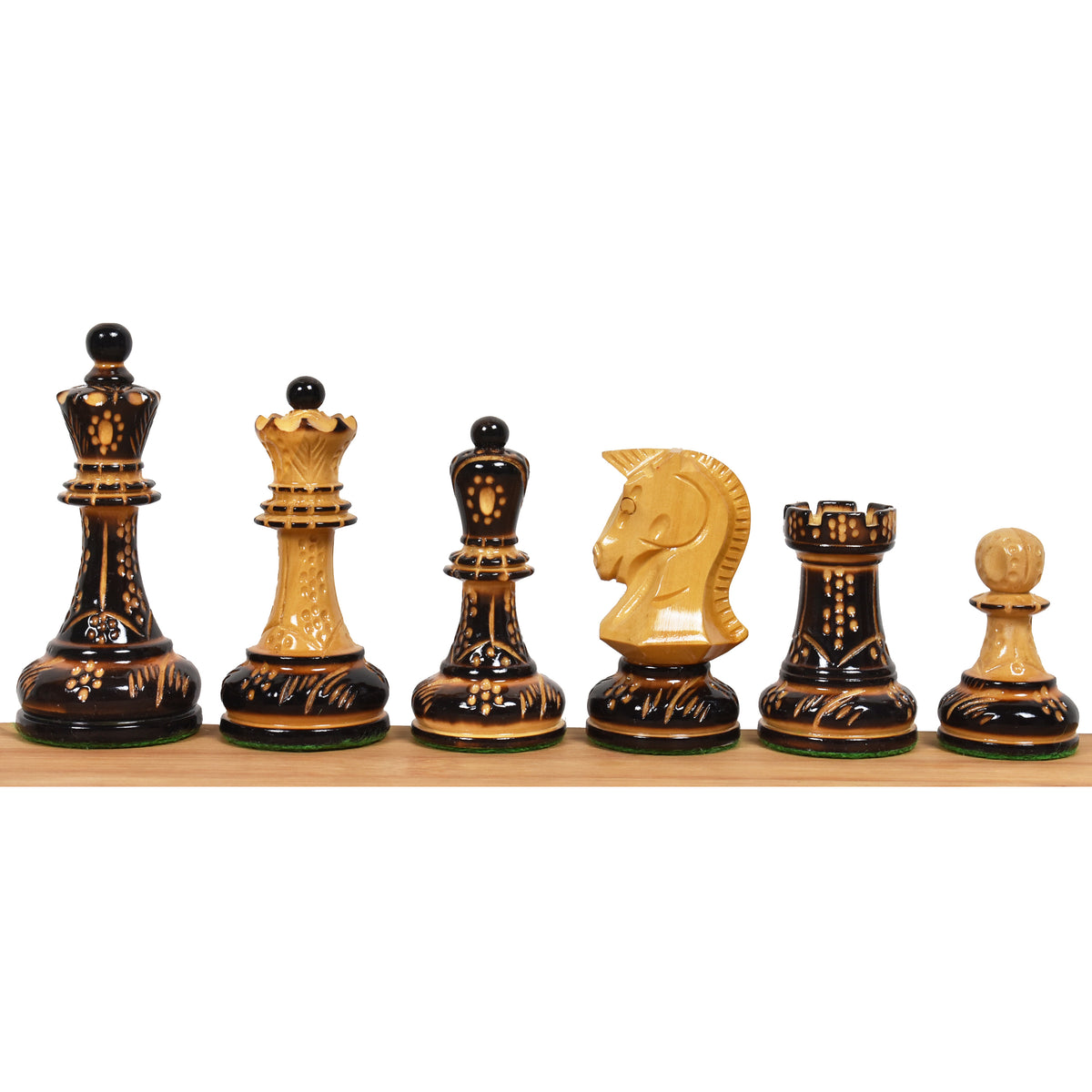 1970s Dubrovnik chess pieces in hand-carved lacquered boxwood showing king, queen, bishop, knight, rook, and pawn.