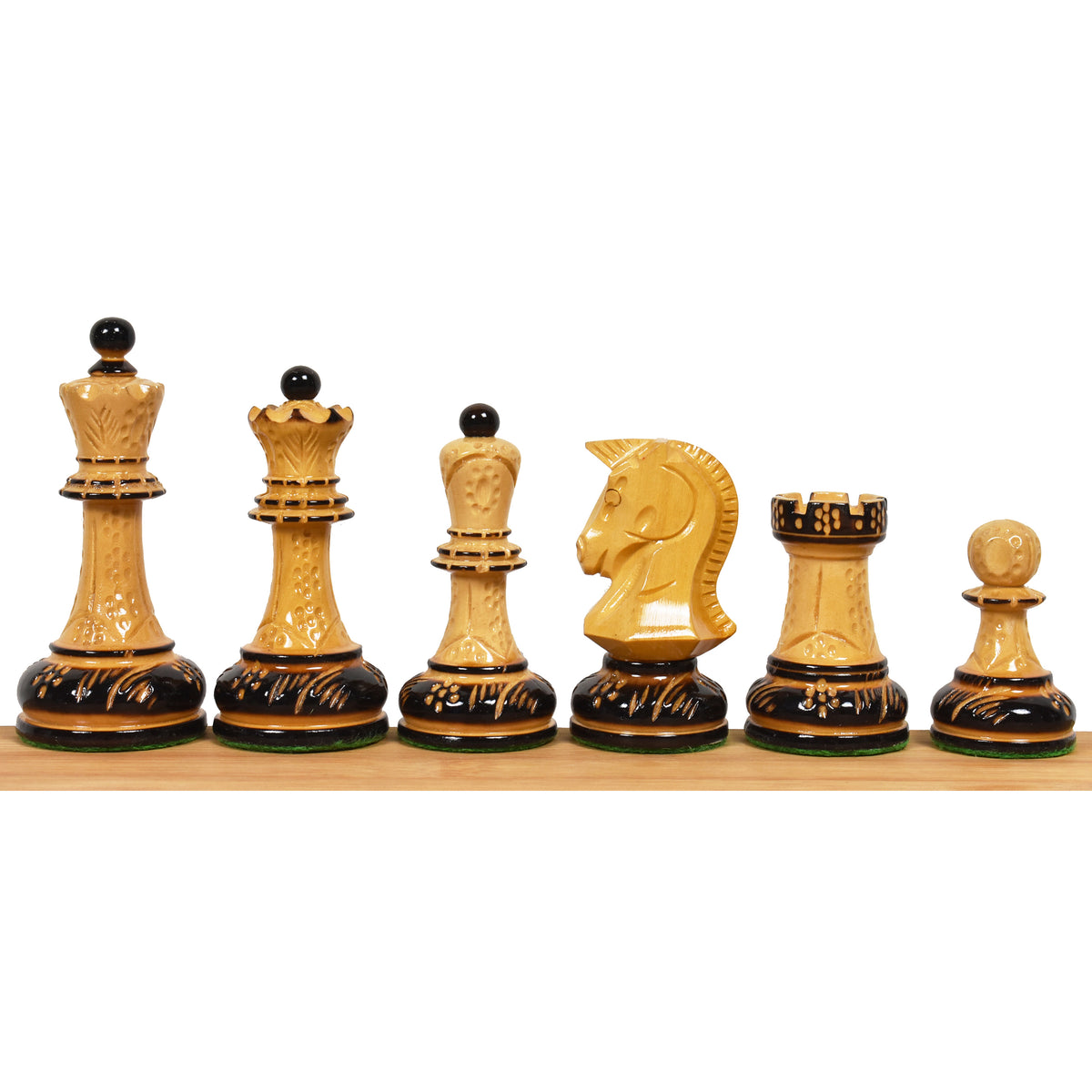 Hand-carved lacquered boxwood chess pieces from the 1970s Dubrovnik reproduction set against a white background.