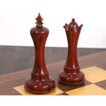 Hand-carved bud rosewood king and queen chess pieces, part of the Avant Garde luxury set.