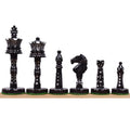Black dyed camel bone Victorian era pre-Staunton chess pieces arranged in a row showcasing their intricate carvings.