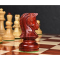Close-up side profile of the iconic 1970s Dubrovnik Knight carved from Bud Rosewood on a wooden chessboard.