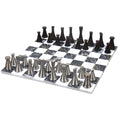 Tower series brass luxury chess pieces set up on a 15-inch black and white veined marble chessboard.