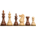 Alternating golden rosewood and boxwood 3.7" British Staunton chess pieces lined up from King to Pawn.