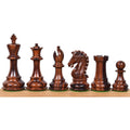 Six dark rosewood 3.9" Craftsman Staunton chess pieces lined up from king to pawn on a wooden surface.