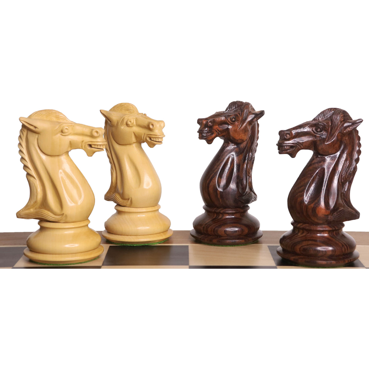 Hand-carved rosewood and boxwood Mammoth Staunton chess knights on a board.