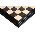 Hand-crafted ebony and maple luxury chess board with a carved border.