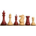 Six Sleek Staunton luxury chess pieces in bud rosewood and boxwood standing in a row.