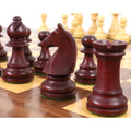 Mahogany stained French Chavet knight chess piece on board.