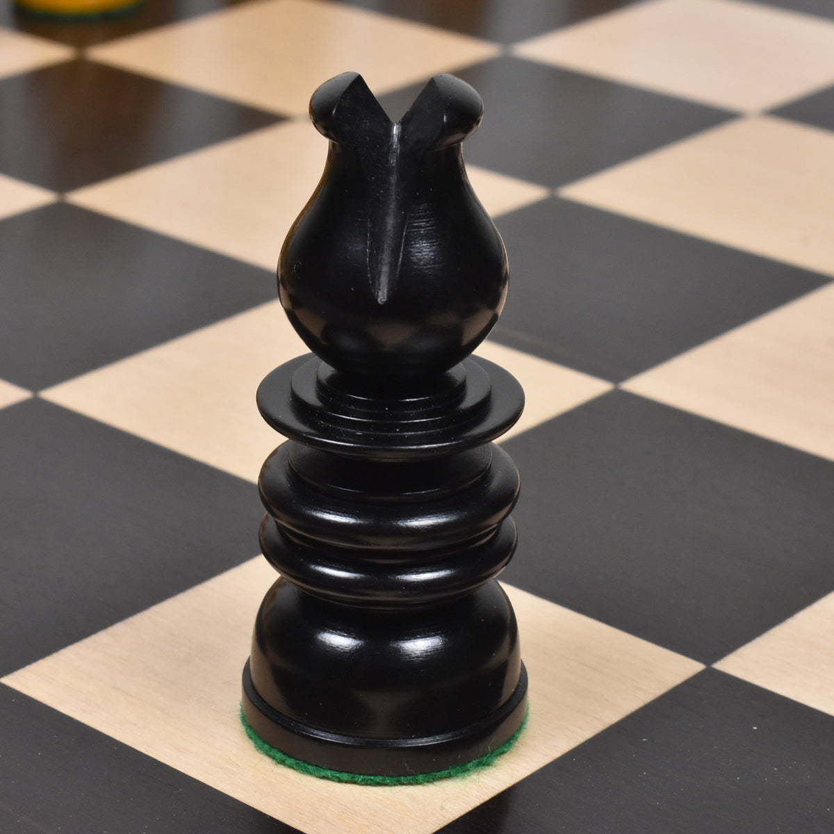 Detailed view of a carved ebony bishop piece from the Calvert St. George collection.