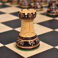 Macro view of the 1970s Dubrovnik rook chess piece showing the hand-carved detailing and lacquered boxwood texture.