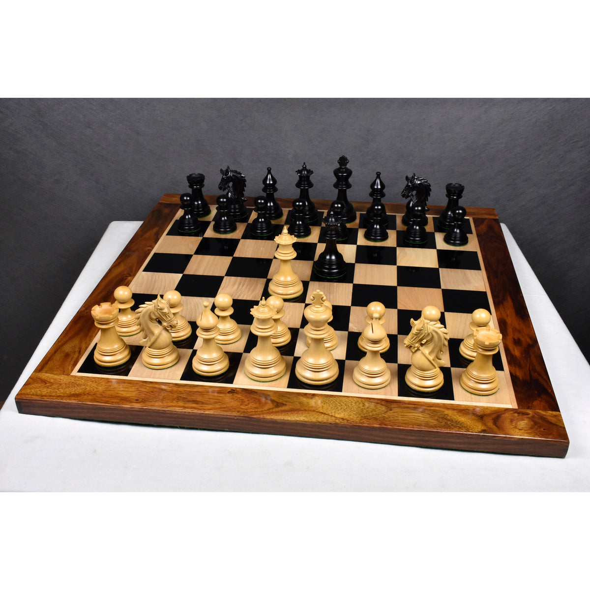 Full 4.3" Napoleon luxury Staunton chess pieces set up on a high-gloss premium wooden chessboard.