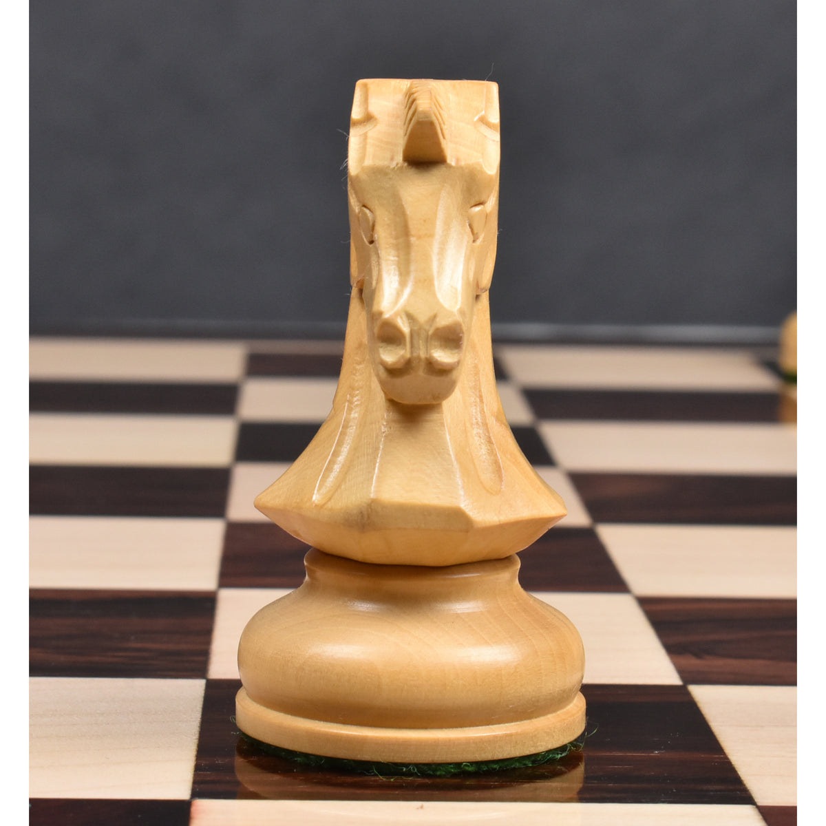 Mid-game arrangement of Rosewood Dubrovnik chess pieces on a luxury board, showcasing piece visibility and playability.