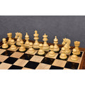 Natural boxwood chessmen from the luxury Napoleon series neatly arranged on wooden board squares.