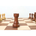 A detailed view of a dark golden rosewood rook piece, part of the Pro Staunton chess collection.