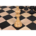 Elegant light boxwood Staunton king chess piece showcased on a premium wooden board.