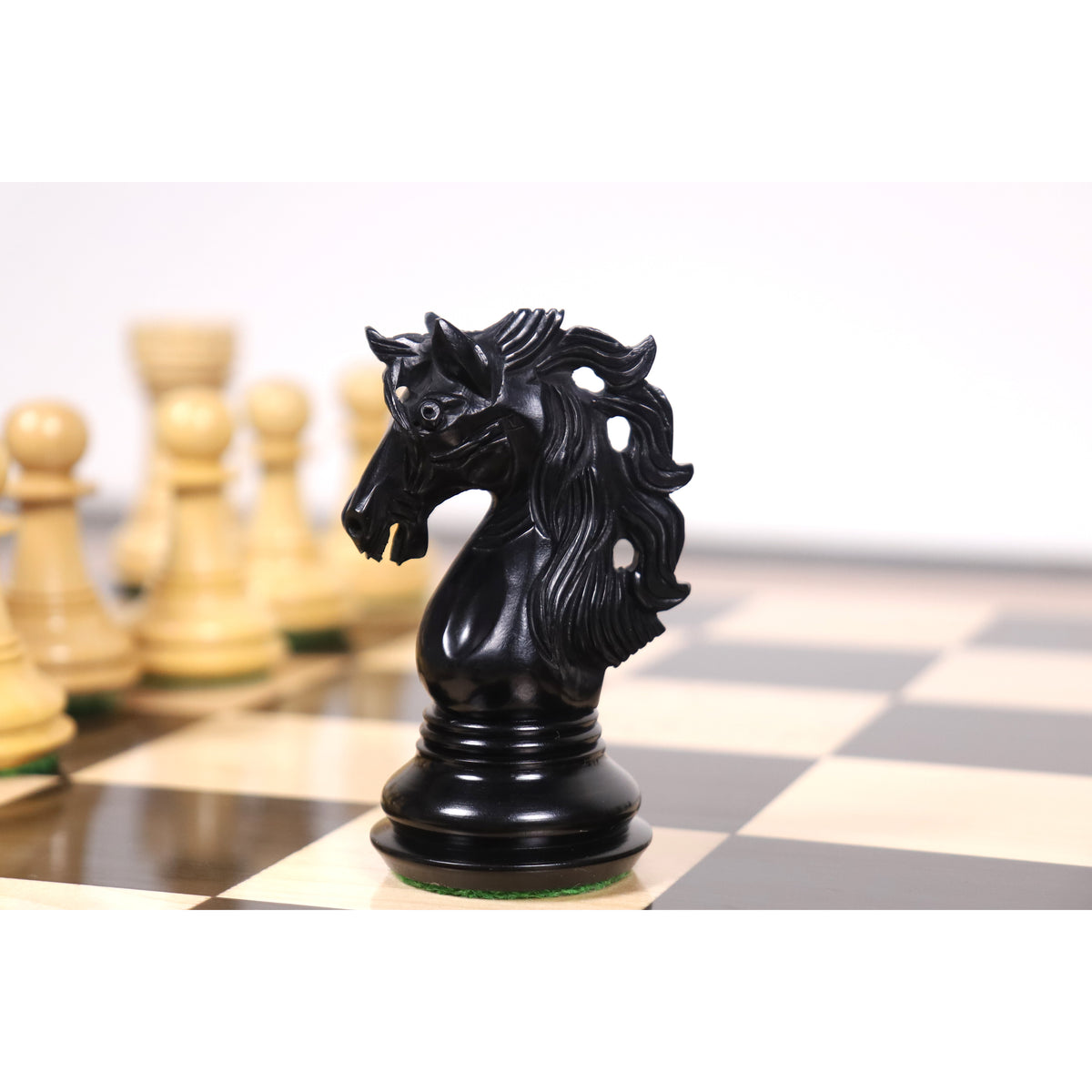 Hand-carved black ebony Spartacus luxury Staunton knight captured from the side profile.