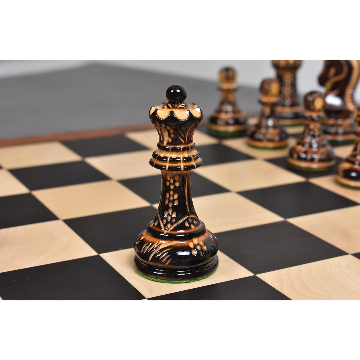 Detailed view of the Dubrovnik queen chess piece with a high-gloss lacquered finish and signature 1970s reproduction carving style.