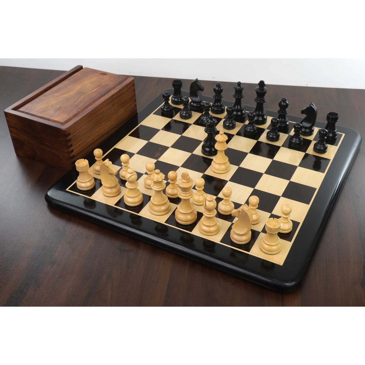 Complete 3.9 inch tournament chess set displayed with its extra queens and protective box.