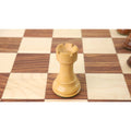 Close-up of a light boxwood rook piece, showcasing the craftsmanship of the Pro Staunton chess set.