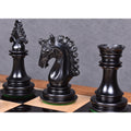 Detailed craftsmanship of a carved ebony wood knight, bishop, and rook on a chessboard.