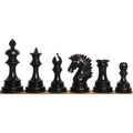 Complete lineup of jet black ebony Alexandria Staunton chess pieces showcased on a white background.