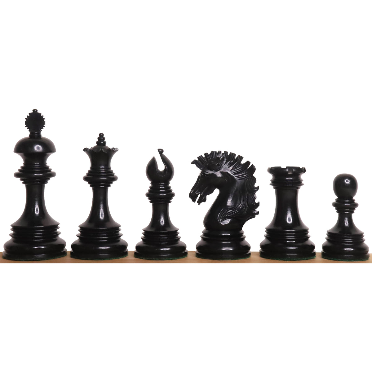 Complete lineup of jet black ebony Alexandria Staunton chess pieces showcased on a white background.