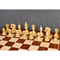 Row of premium natural boxwood Napoleon style luxury chess pieces on a matching wooden board.