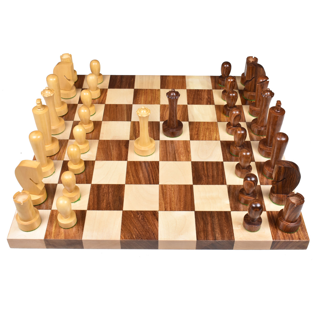 Front eye-level view of the complete Berliner modern minimalist chess pieces on a wooden board.