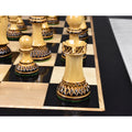 Parker Staunton lacquer gloss finish boxwood chess pieces aligned on a premium board.