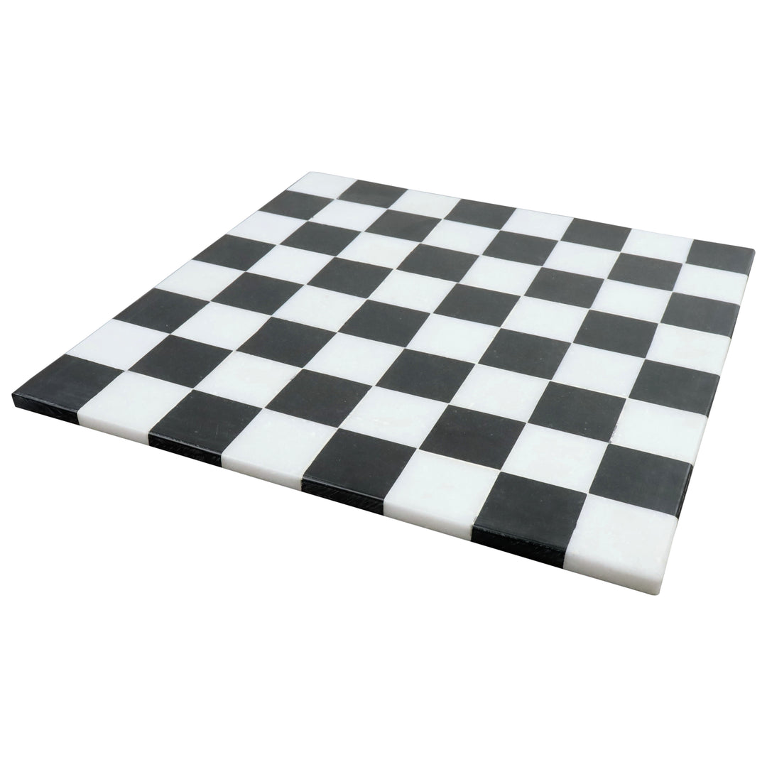 Minimalist 15 inch borderless marble chess board with solid black and white stone squares.
