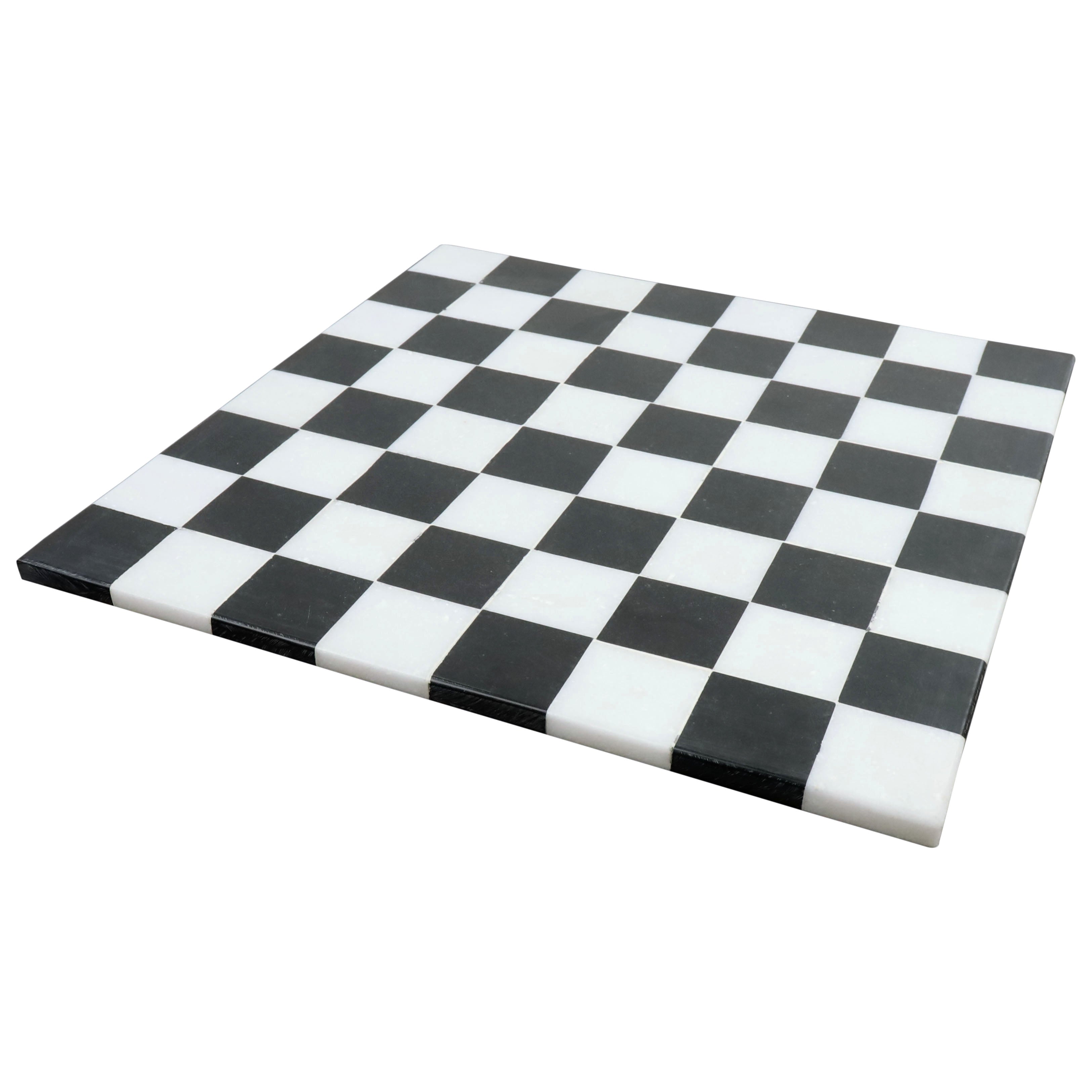 Minimalist 15 inch borderless marble chess board with solid black and white stone squares.