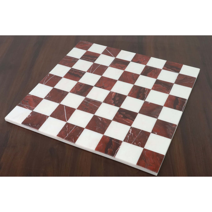 Full 15 inch borderless marble chess board with maroon and white squares on a dark wooden surface.