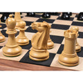 Grouping of natural boxwood pieces including bishop, knight, and rook on a checkered chess board.