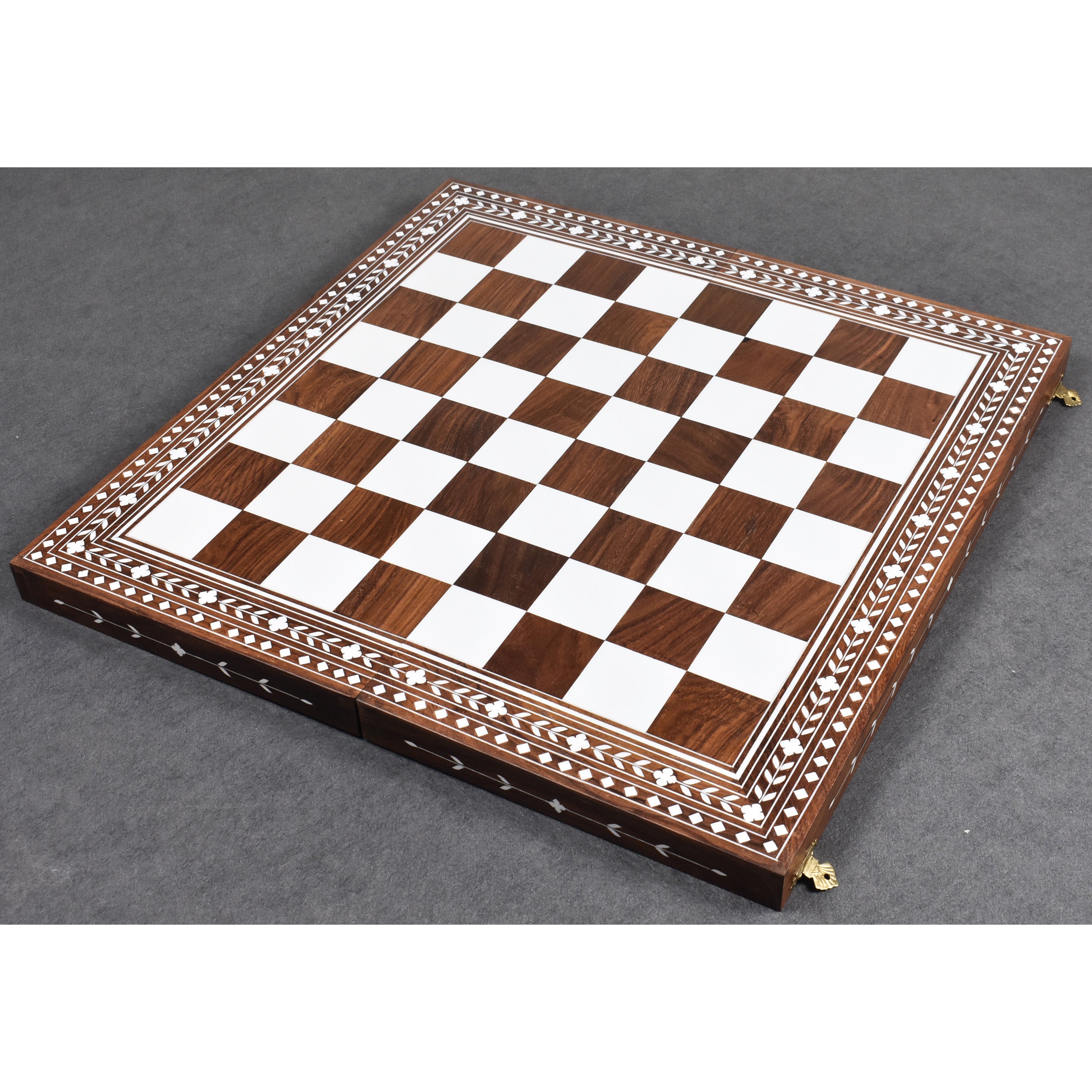 Fully opened 18 inch golden rosewood chess board featuring white acrylic ivory inlaid squares and borders.