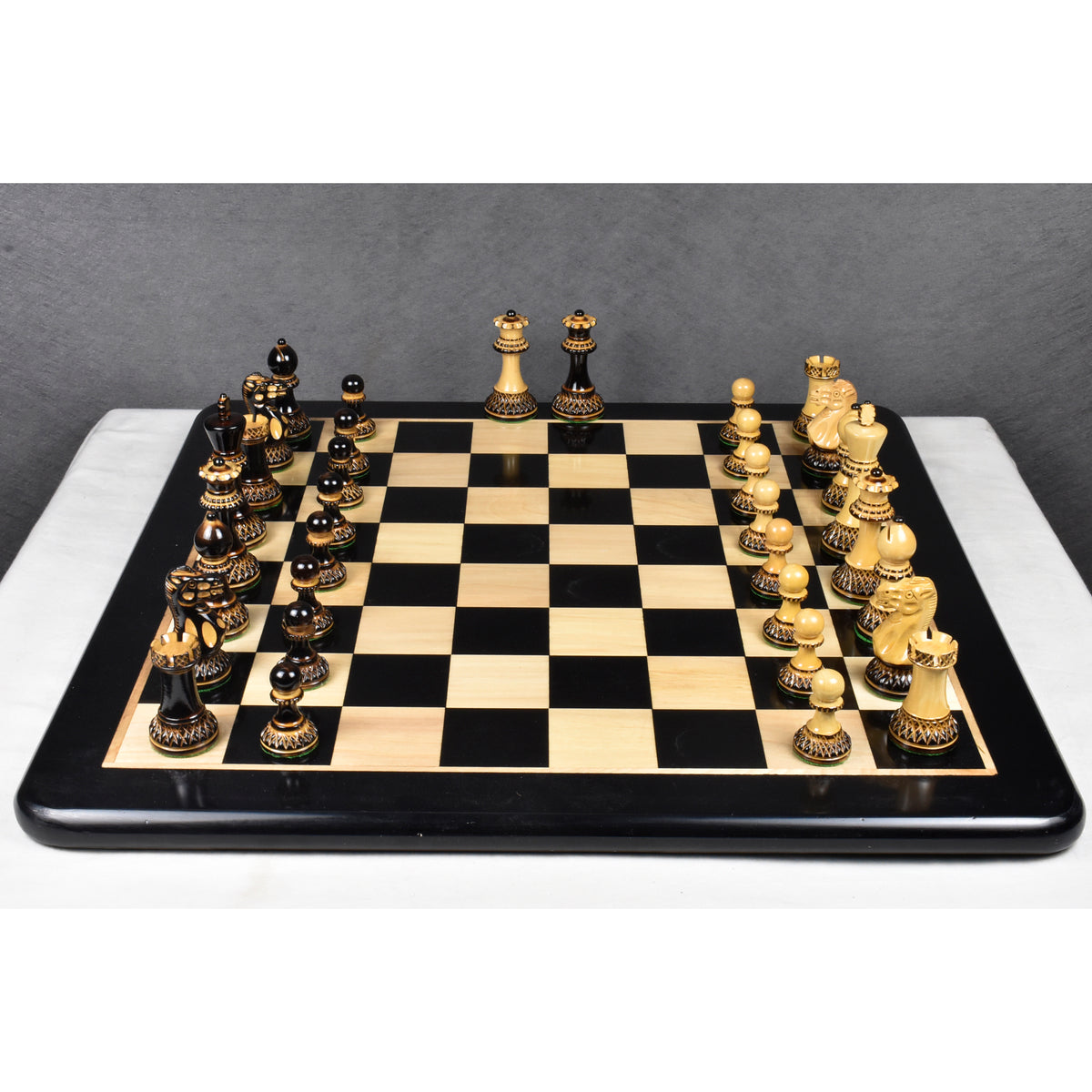 Overhead view of the lacquer gloss finish Parker Staunton chess pieces set ready for play.