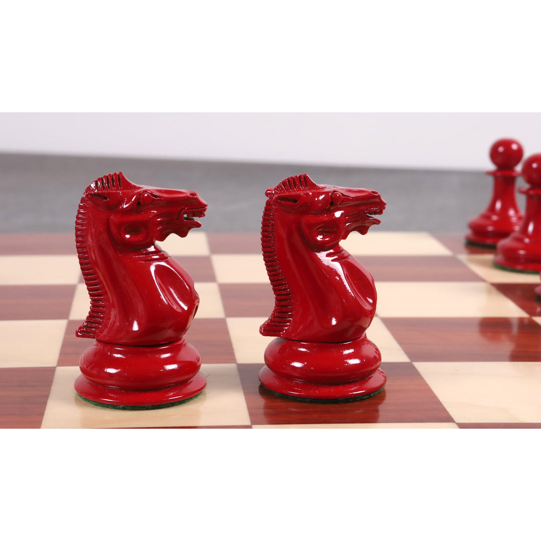 Pair of red hand-carved knights from the 1849 Jacques Cook Staunton collectors chess set.