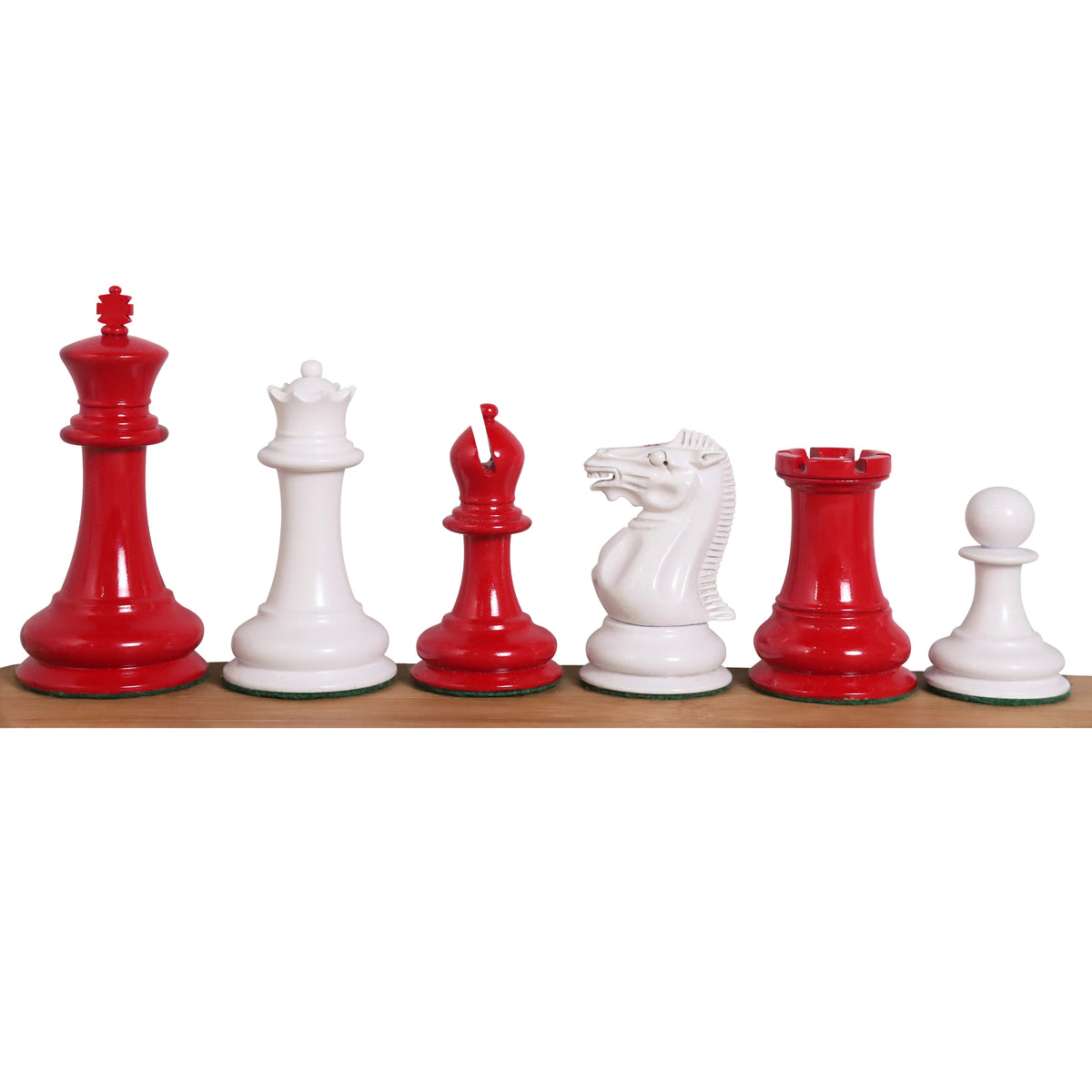 Red and white 1849 Jacques Cook Staunton style chess pieces displayed in a row.
