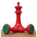 Crimson camel bone king piece from the 1849 Jacques Cook set showing green billiard cloth felt base.