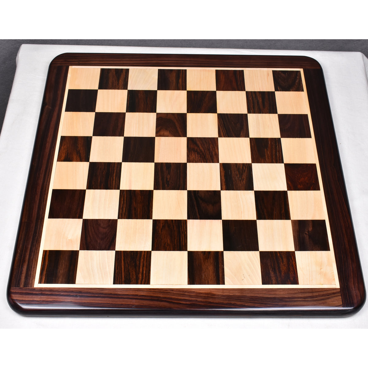 Top-down view of a 19-inch flat chess board crafted from solid rosewood and maple wood.