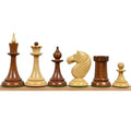 Soviet Latvian reproduction chess pieces in golden rosewood and boxwood showing slender stems.