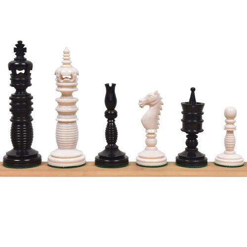 Minaret series camel bone chess pieces in black and white lined up on a wooden surface.