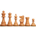 Light antiqued boxwood Improved French Lardy chess pieces in a line.