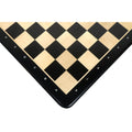 Close-up of the corner of a 21 inch Ebony and Maple wood chess board showing algebraic notations A, B, C and numbers 7, 8.