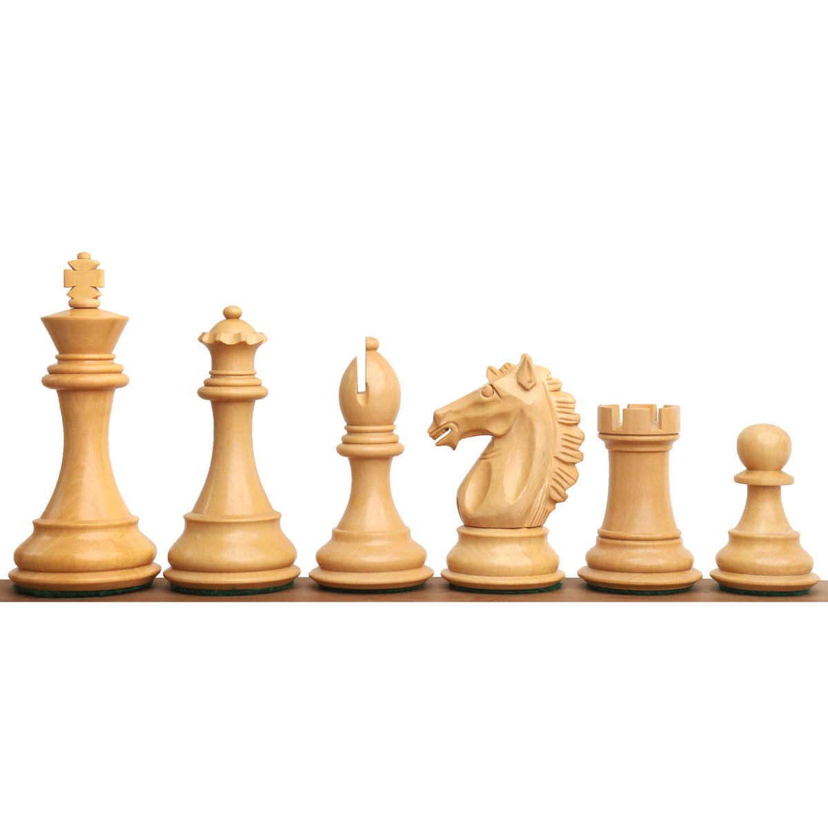 Boxwood Alban Knight Staunton chess pieces standing in a row from king to pawn.