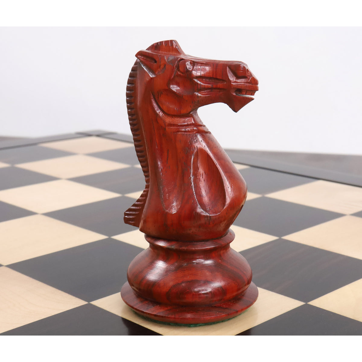 Handcrafted bud rosewood knight piece from the jumbo pro Staunton luxury chess set showing fine carved details.
